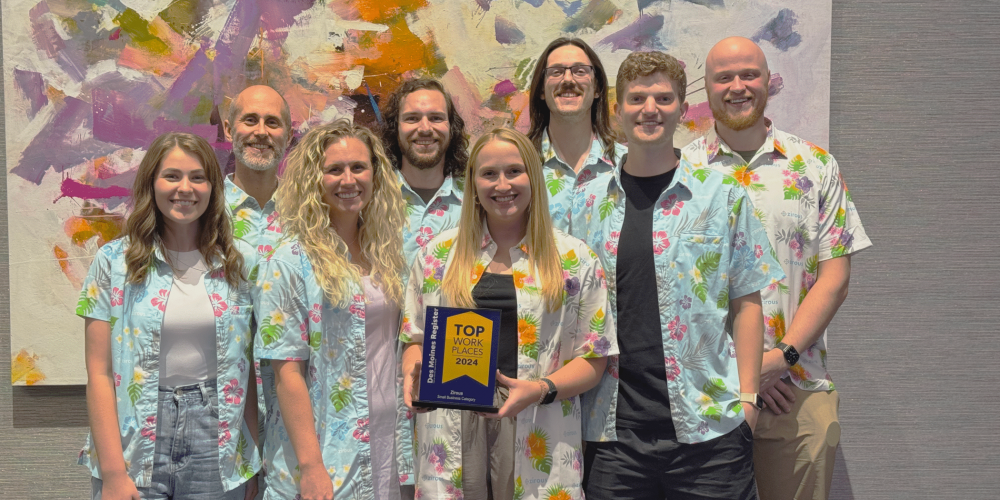Zirous employees holding the award for Top Workplaces of 2024