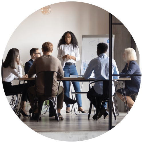 Image of a group of people in a boardroom having a meeting.